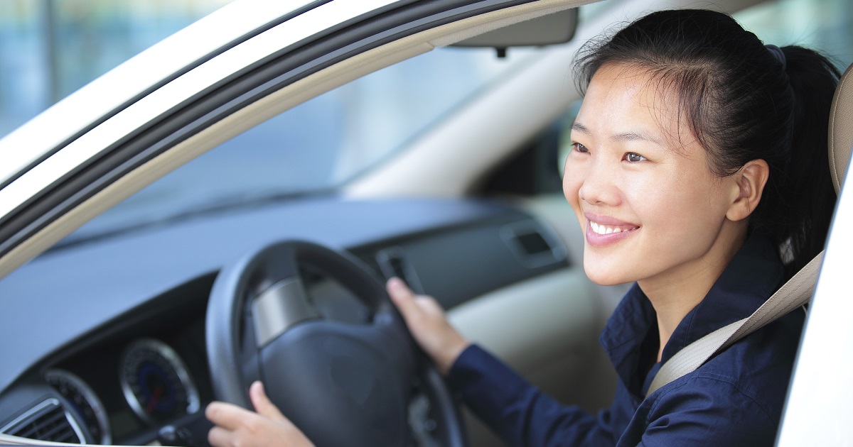 Driver smiles out car window