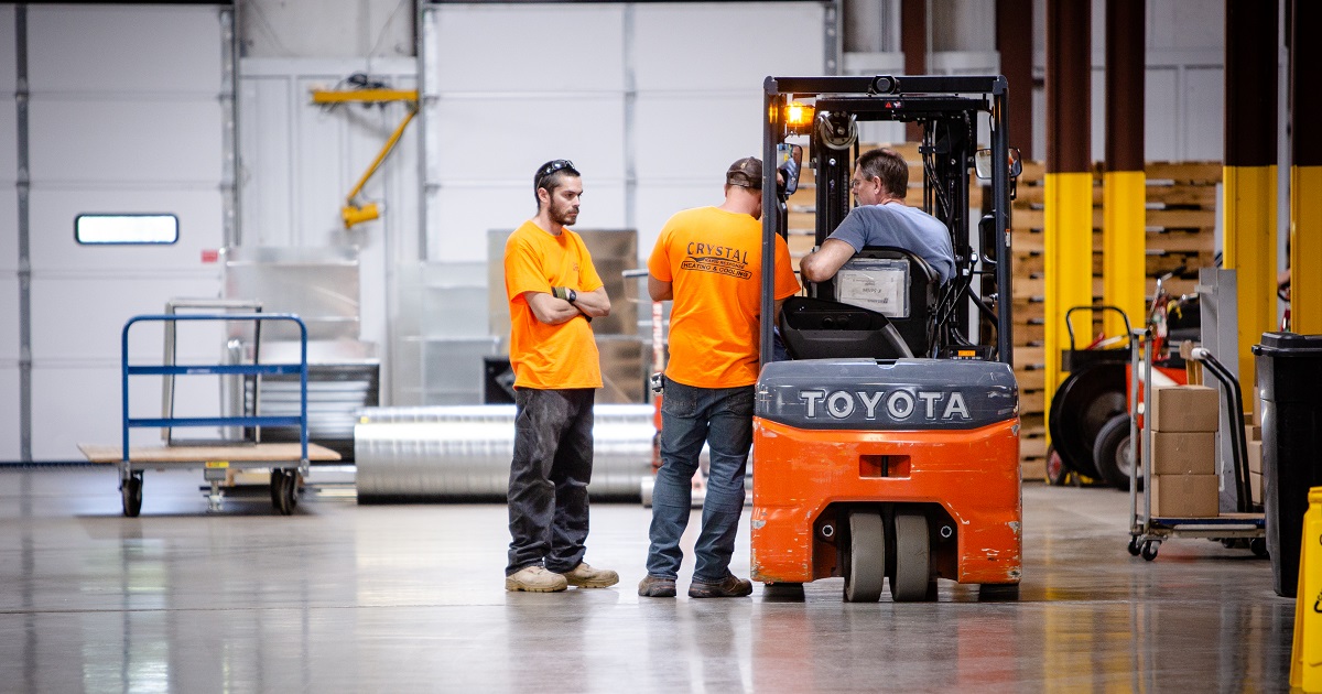 Warehouse Employees with Forklift